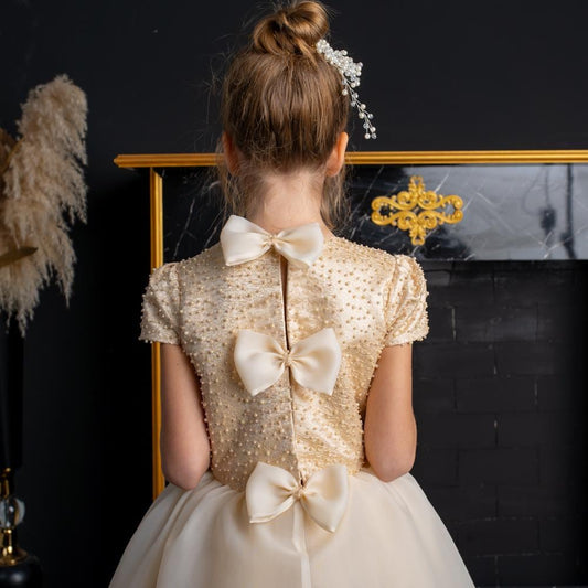 Elegant Champagne Floor-Length Flower Girl Dress with Pearls, Satin Bows & Matching Bag for Weddings