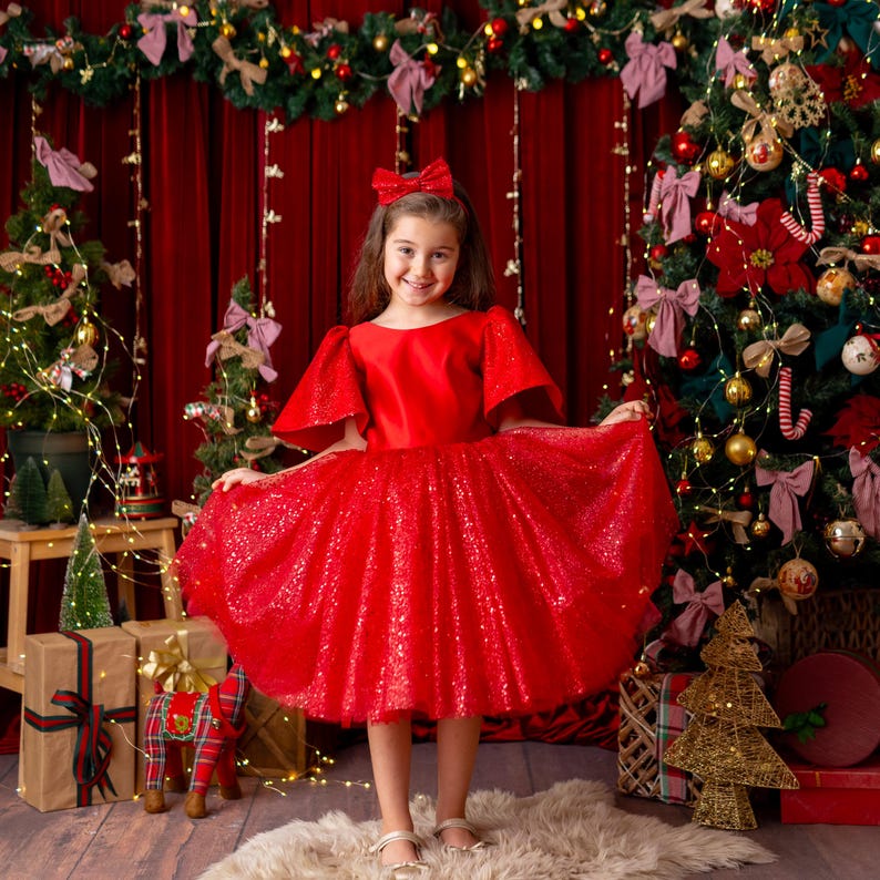 Full front view of red satin flower girl dress with glitter tulle skirt