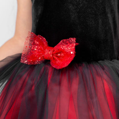 Close up of red bow detail on black and red velvet flower girl dress with layered tulle skirt
