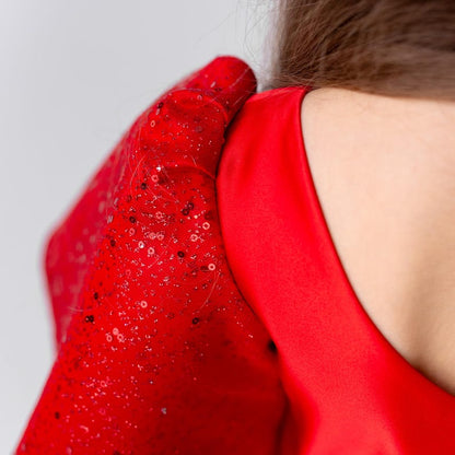 Button closure detail on back of red satin flower girl dress