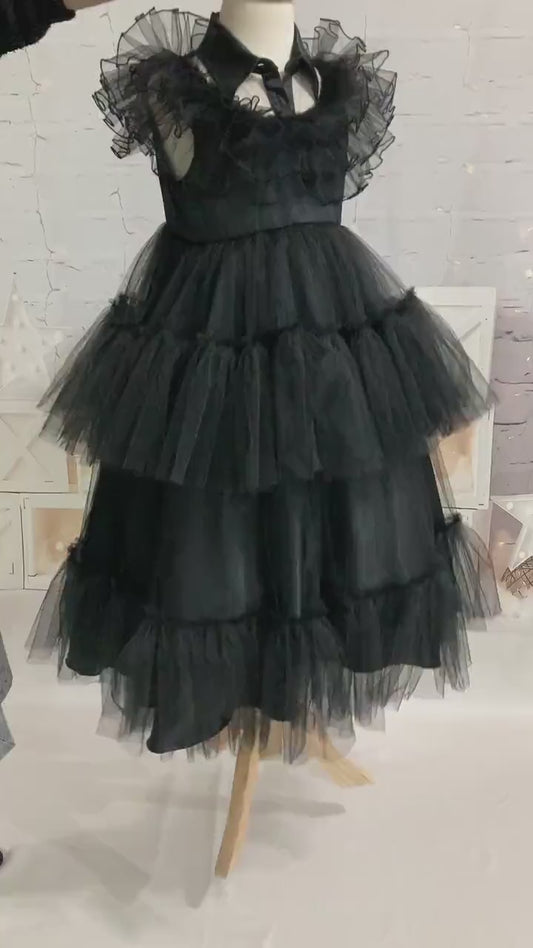 Video showing black Wednesday Addams kids tulle dress fit, movement, and layered skirt flow